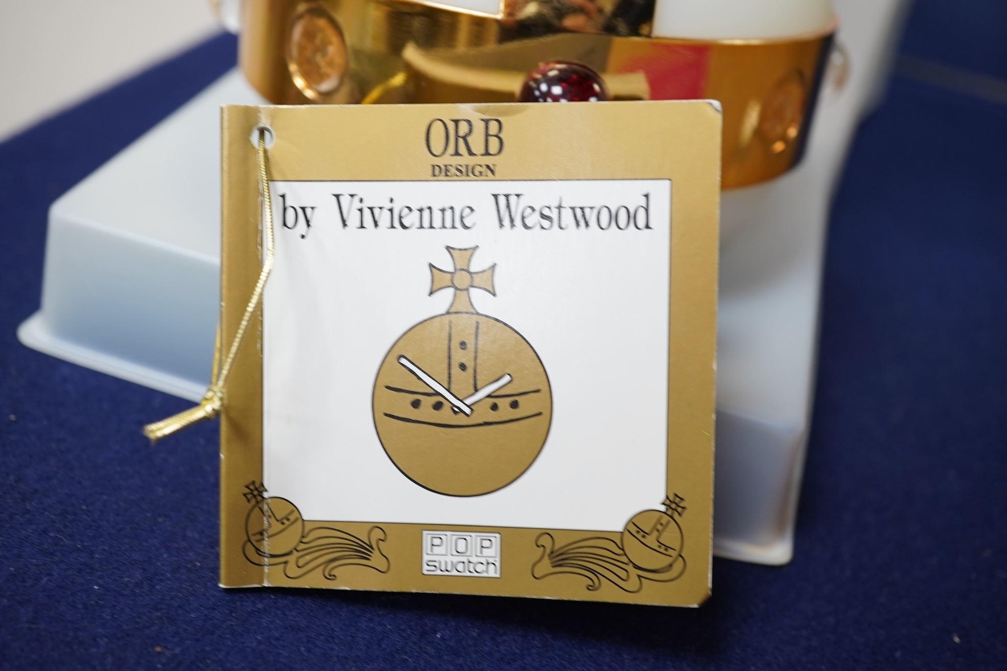 A late 20th/early 21st century Vivienne Westwood 'Orb' pop Swatch quartz wrist watch, on a velvet mounted leather strap, with original box and pamphlet.